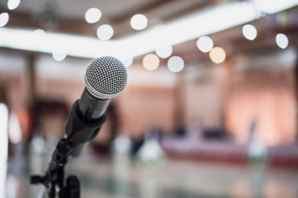 istock Seminar Conference Concept : Microphones for speech or speaking in seminar conference hall, prepare for talking lecture to audience university. Business meeting or education teaching ideas 1167946631
