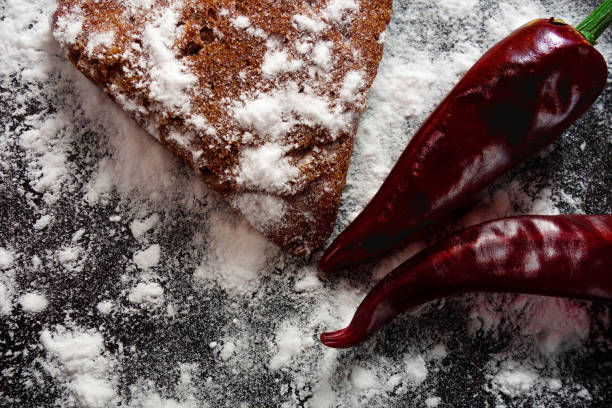 Red hot peppers with white powder decoration close up image. Cooking kitchen close up image of spices