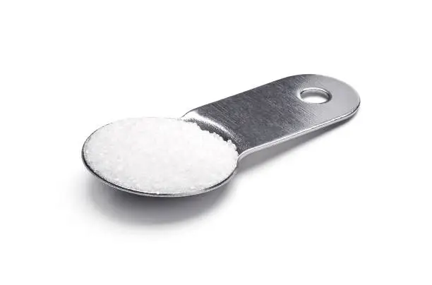 One tablespoon of sugar on white background - clipping path included