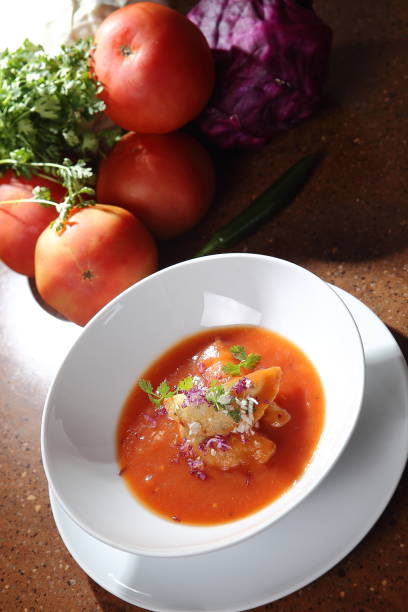 istock Tomato cream with purple onion and croutons. 1167950825