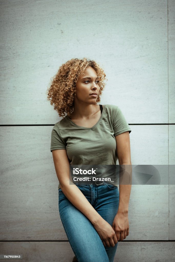 Portrait Of Mixed Race Woman With Curly Hair Stock Photo - Download Image  Now - 20-29 Years, Adult, Adults Only - iStock