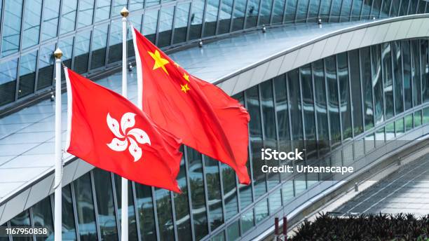 Hong Kong And Mainland China National Flags Stand Together With Copy Space Nation Symbol Countries Political Conflict Concept Stock Photo - Download Image Now