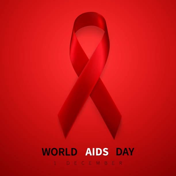 istock World aids day symbol, 1 december. Realistic red ribbon symbol. Medical Design. Vector illustration 1167951136