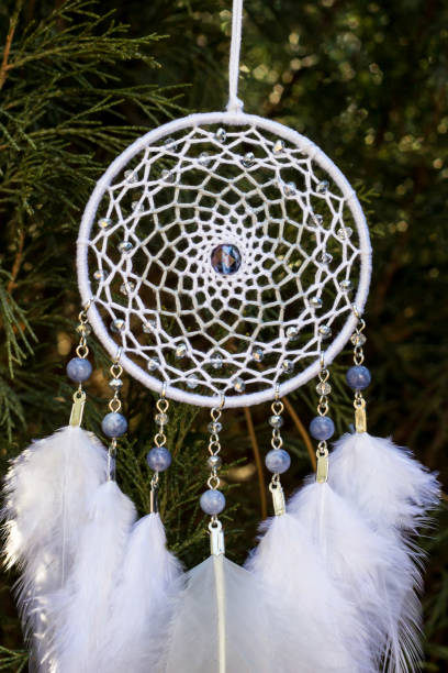 istock Handmade dream catcher with feathers threads and beads rope hanging 1167963124