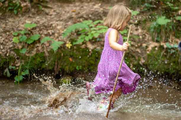 istock Girl running in forest 1167963546