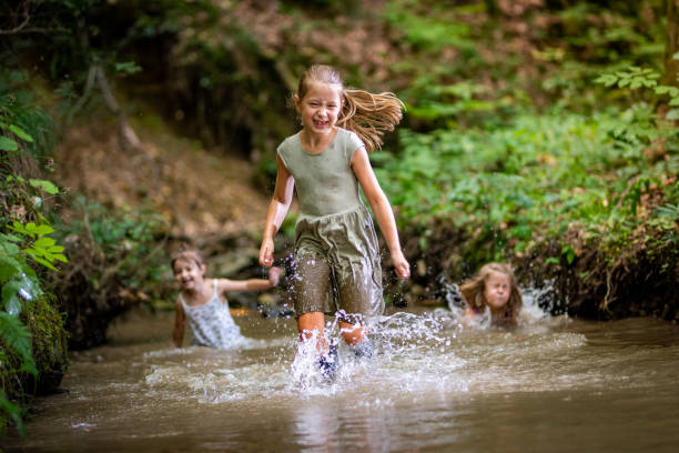 istock Girls playing in water 1167963557