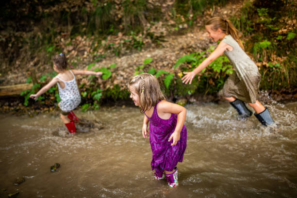 istock Girls playing in water 1167963589
