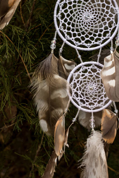 istock Handmade dream catcher with feathers threads and beads rope hanging 1167963769