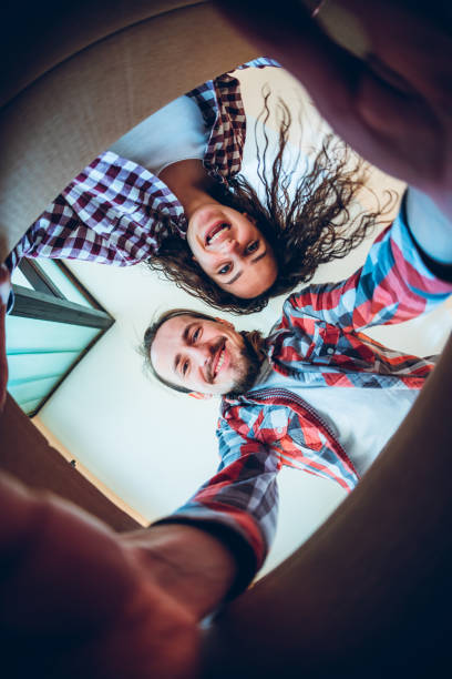 istock Happy young couple looking inside the box 1167963852