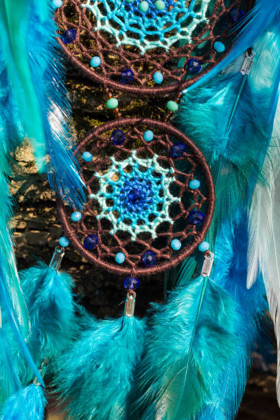 istock Handmade dream catcher with feathers threads and beads rope hanging 1167964040