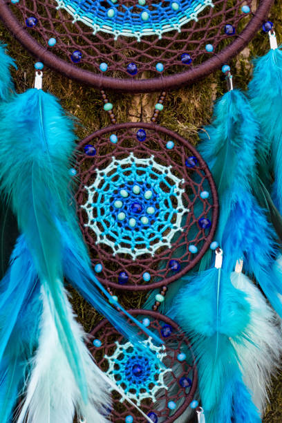 istock Handmade dream catcher with feathers threads and beads rope hanging 1167964042
