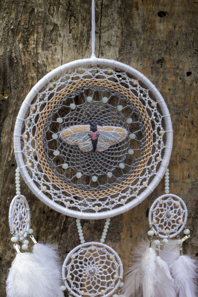 istock Handmade dream catcher with feathers threads and beads rope hanging 1167964226
