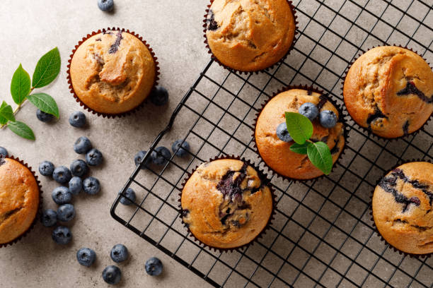 istock Blueberry muffins with fresh berries, top view 1167964955