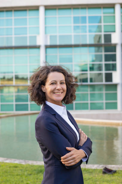 istock Happy successful business professional posing outside 1167964978