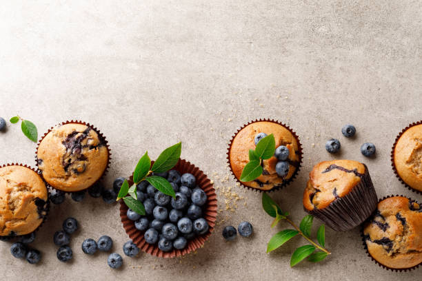 istock Blueberry muffins with fresh berries, top view 1167965406