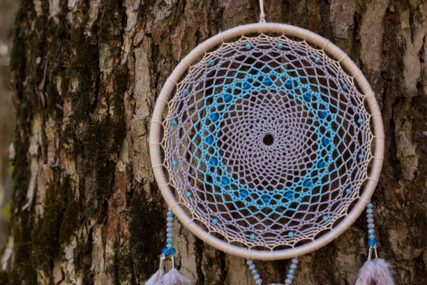 istock Handmade dream catcher with feathers threads and beads rope hanging 1167965493