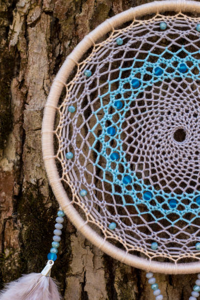 istock Handmade dream catcher with feathers threads and beads rope hanging 1167965513
