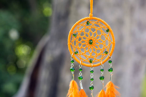 istock Handmade dream catcher with feathers threads and beads rope hanging 1167965738