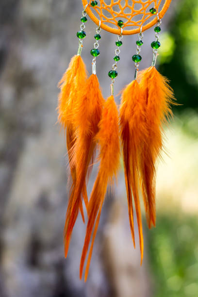 istock Handmade dream catcher with feathers threads and beads rope hanging 1167965749