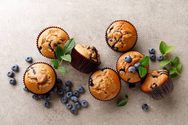 istock Blueberry muffins with fresh berries, top view 1167965756