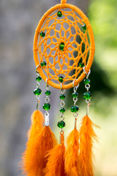 istock Handmade dream catcher with feathers threads and beads rope hanging 1167965774