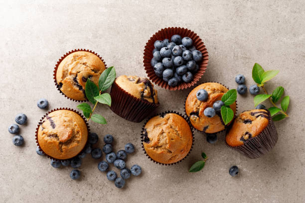 istock Blueberry muffins with fresh berries, top view 1167967003