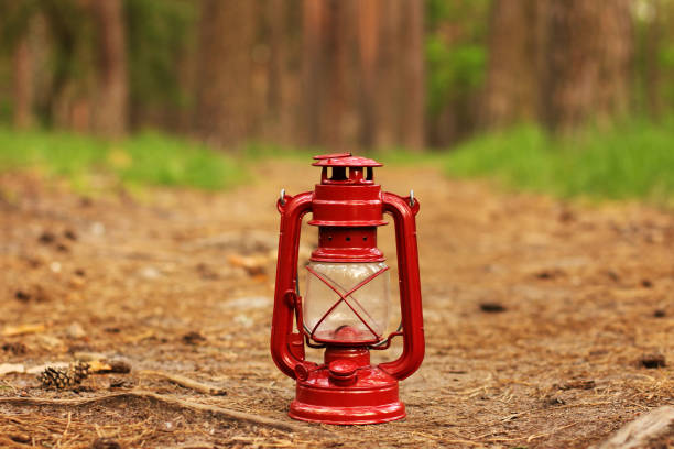 kerosene lamp in the forest. abstract photo - oil lantern imagens e fotografias de stock
