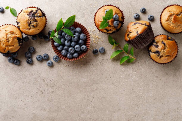 istock Blueberry muffins with fresh berries, top view 1167967113