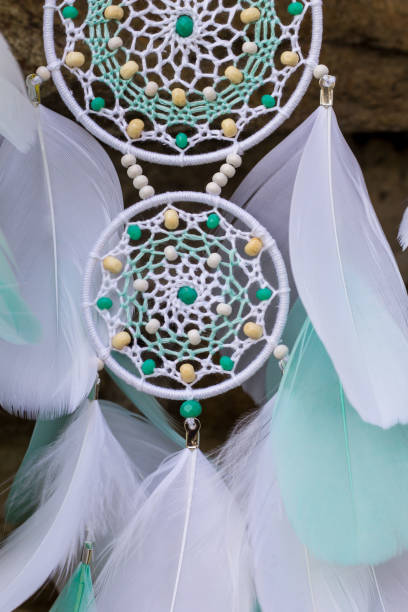 istock Handmade dream catcher with feathers threads and beads rope hanging 1167967180