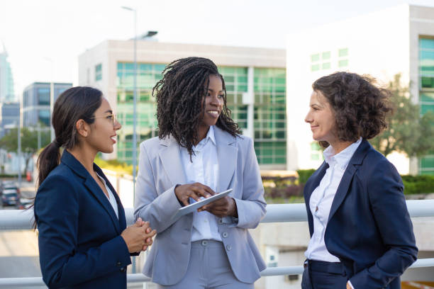 istock Smiling businesswomen with tablet pc 1167967264