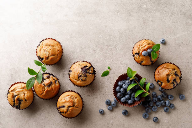 istock Blueberry muffins with fresh berries, top view 1167967771
