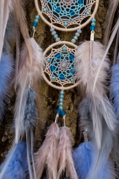 istock Handmade dream catcher with feathers threads and beads rope hanging 1167968973