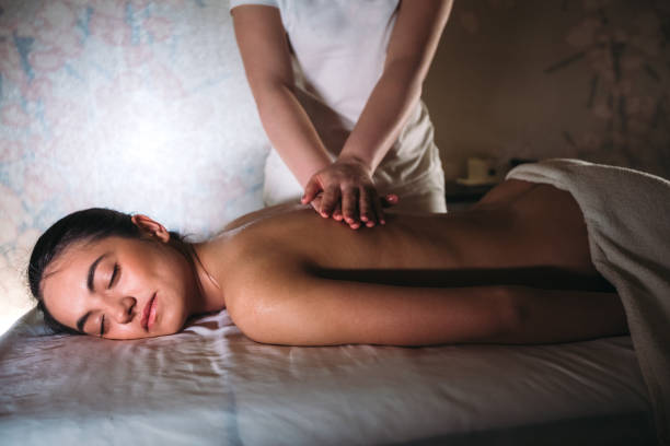 istock Young woman having back massage at the spa 1167969311