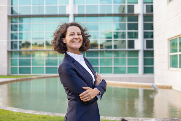 istock Joyful confident female ceo posing outside 1167970237