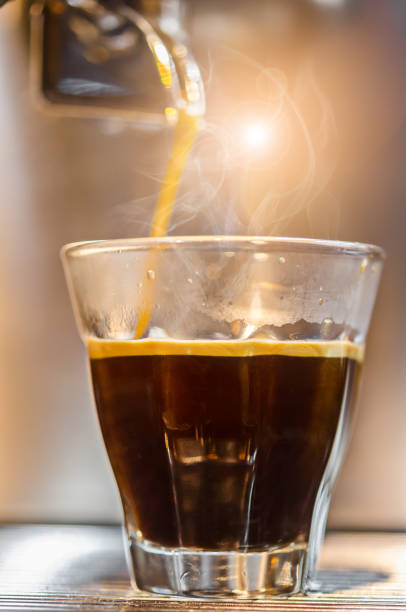 istock Barista making a espresso with a classic coffee machine 1167970848