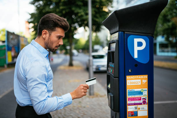 istock Millennial businessman using ticketing machine and paying contactless 1167970987