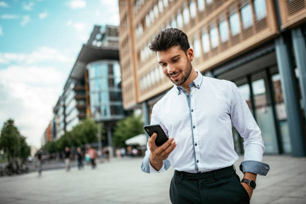 istock Millennial businessman using phone for business plannings 1167971452