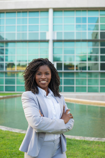 istock Cheerful smiling female professional posing near office 1167971738