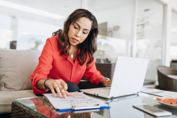 istock Mature Latin woman working on laptop 1167971755