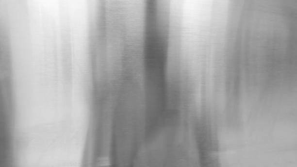 istock Abstract texture background, light shining on rough gray metal wall 1167971795