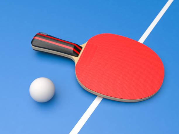 istock Red table tennis racket with ball. On blue background 1167971961
