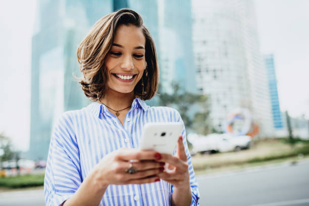 istock Millennial Latinas using mobile phones for communication and social media sharing 1167975676