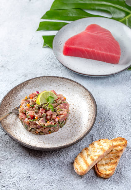 tuna fish tartar tartare on gray plate - tuna steak tuna prepared ahi meat imagens e fotografias de stock