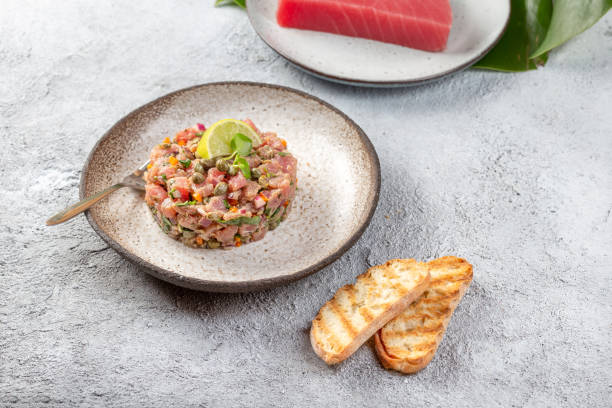 istock Tuna fish TARTAR tartare on gray plate 1167979053