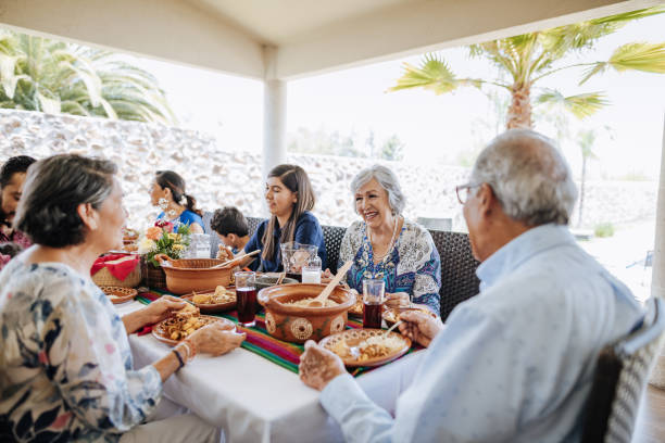 istock Caring multi generation Latin American family eating dinner 1167979188