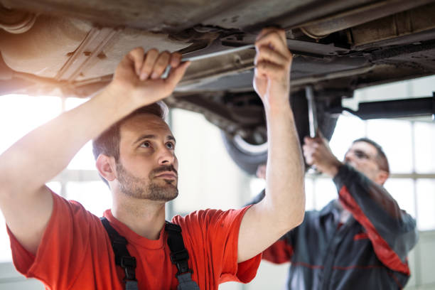 istock Car mechanics working at automotive service center 1167980025