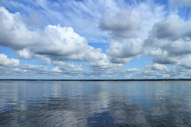 Beautiful cloudy scenery over the sea mirror reflection