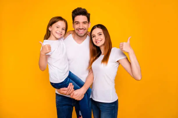 Portrait of three nice attractive charming cute lovely sweet cheerful cheery, person showing thumbup cool good solution decision isolated over bright vivid shine yellow background