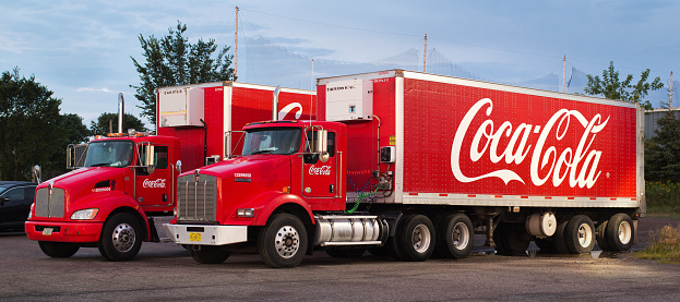 Truro, Canada - August 13, 2019: Parked Coca-Cola transport trucks. The Coca-Cola Company sells soft drinks around the world and is headquartered in Atlanta, Georgia.