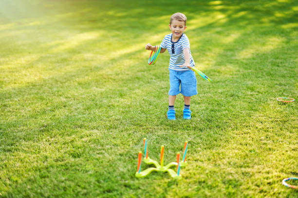 istock Happy 3 year old boy having fun playing outside 1167985691